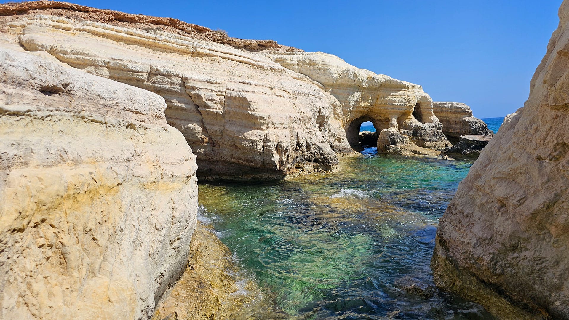 interesting skull shaped rock at Olive Tree Beach Peyia