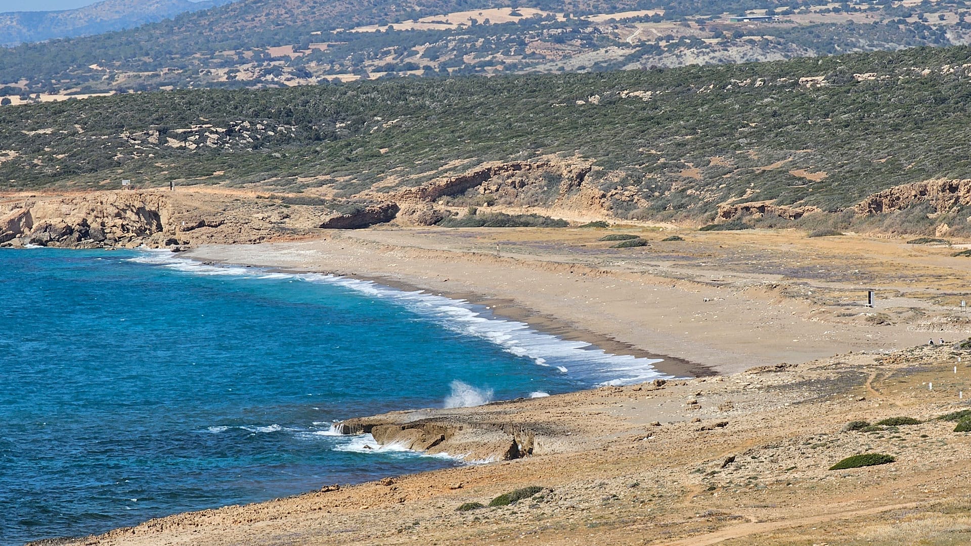 Toxeftra Beach with mountain in the background